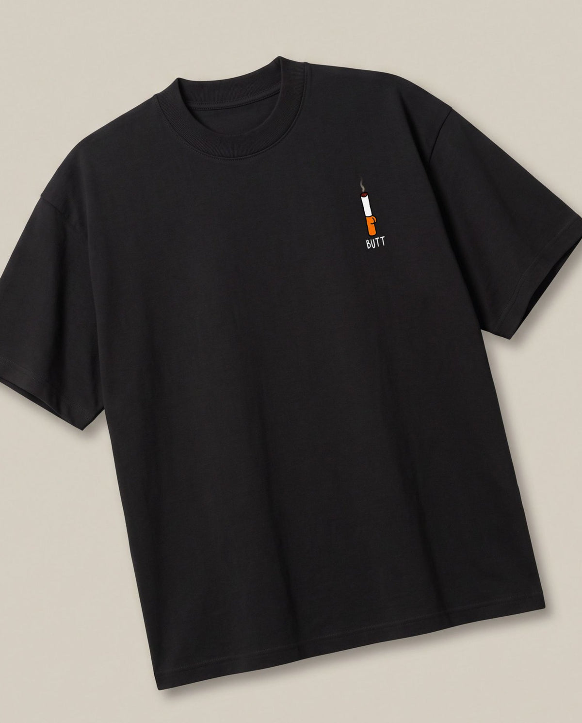 Cigarette Butt Black oversized t-shirt — cigarette butt minimalist pocket pun, angled view