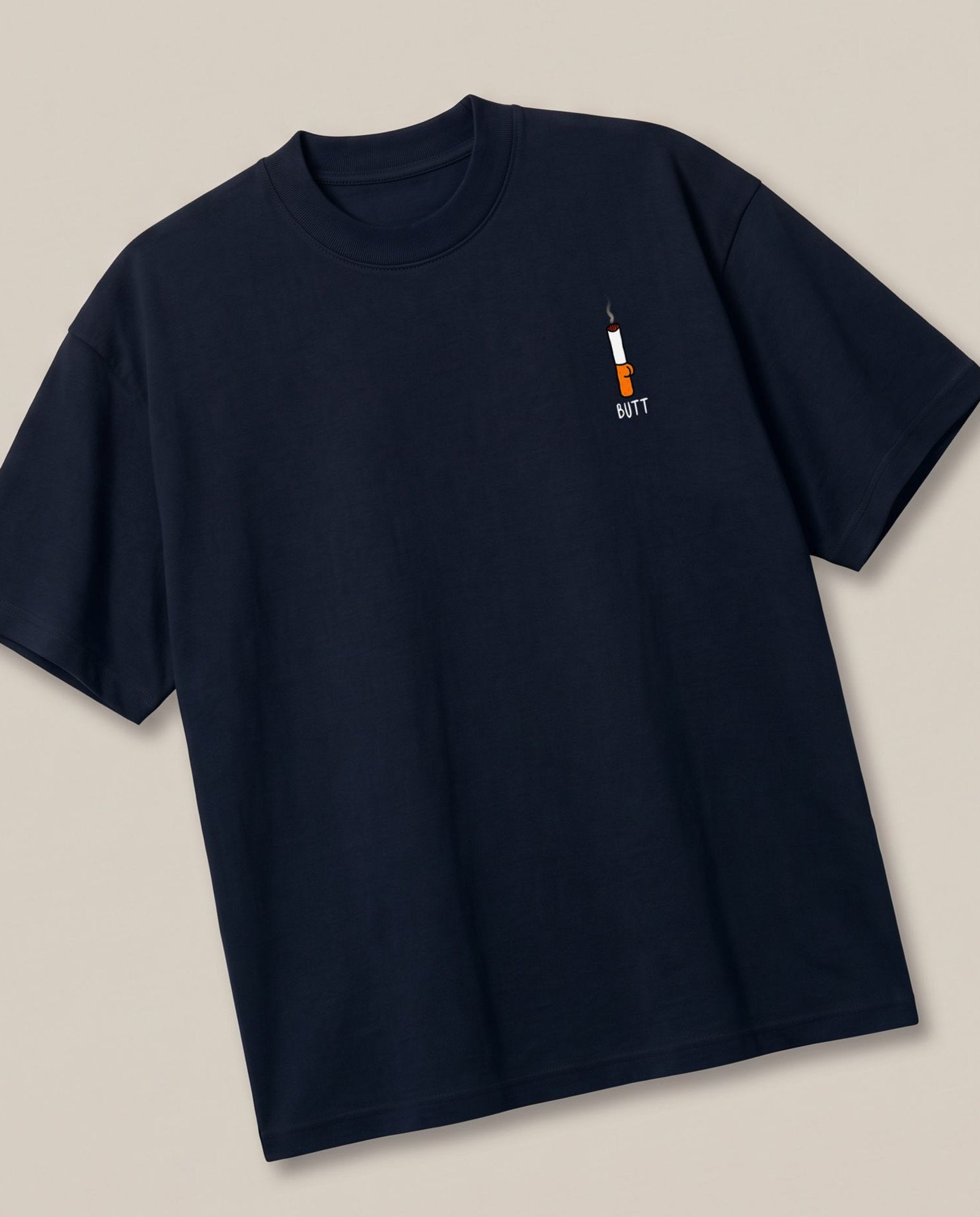 Cigarette Butt Navy oversized t-shirt — cigarette butt minimalist pocket pun, angled view