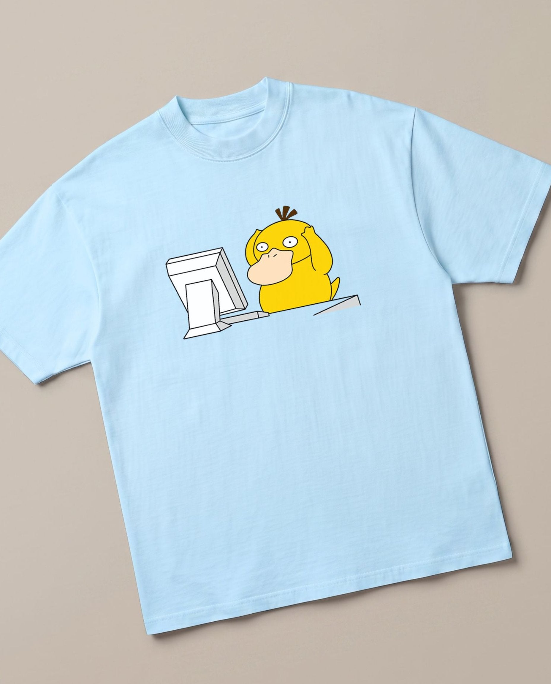 Corporate Psyduck Baby Blue oversized t-shirt — psyduck pokemon is afraid after seeing his office work, angled view