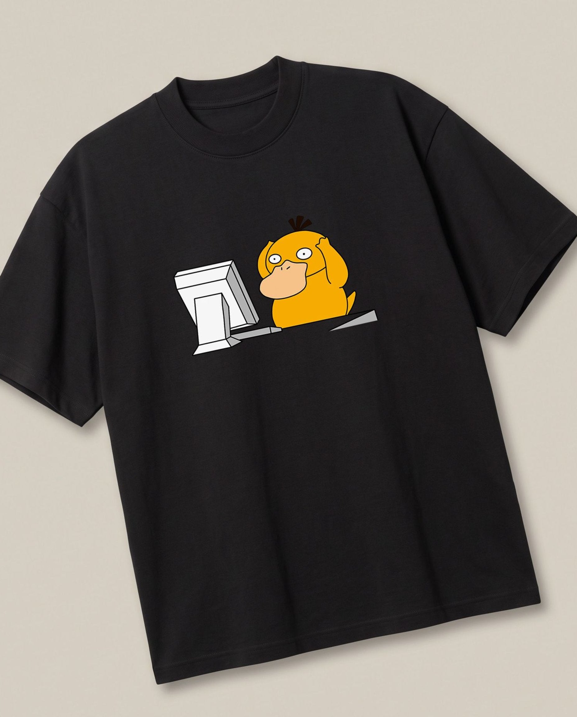Corporate Psyduck Black oversized t-shirt — psyduck pokemon is afraid after seeing his office work, angled view