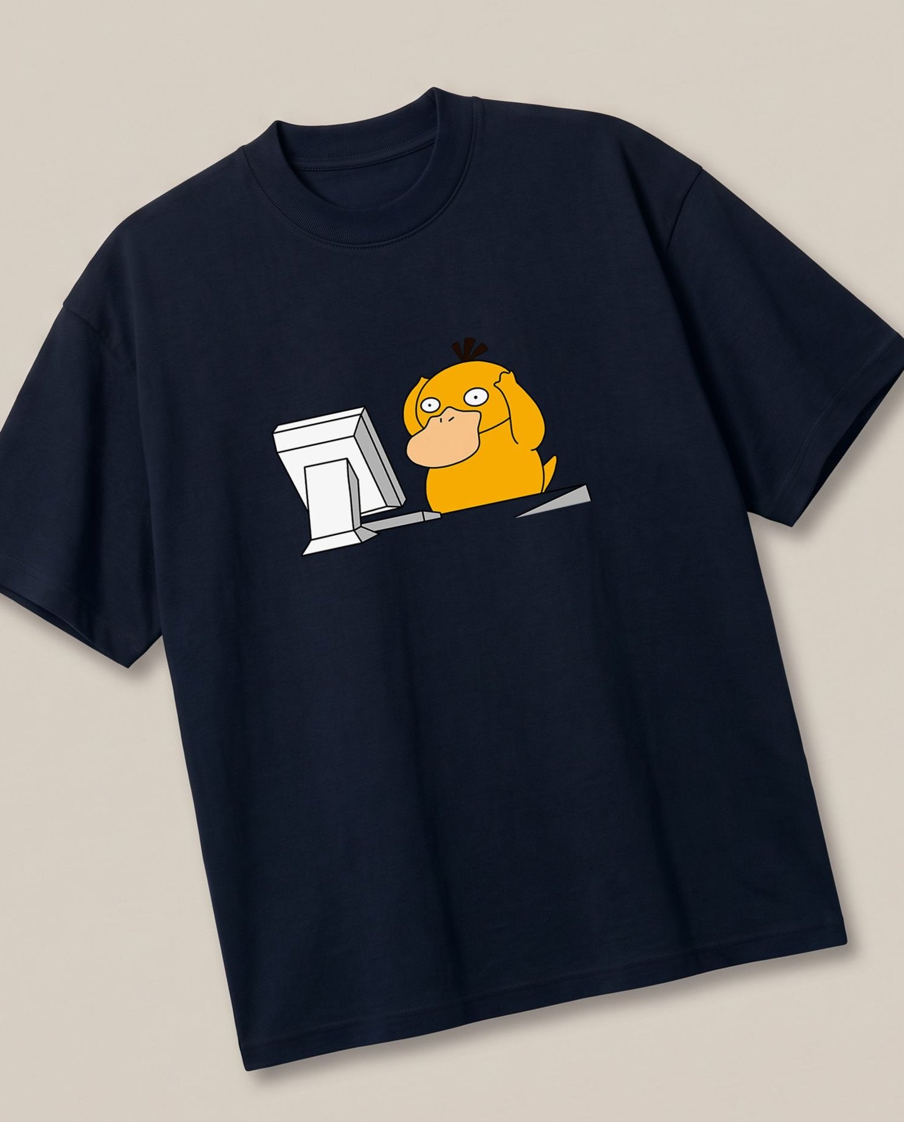 Corporate Psyduck Navy oversized t-shirt — psyduck pokemon is afraid after seeing his office work, angled view