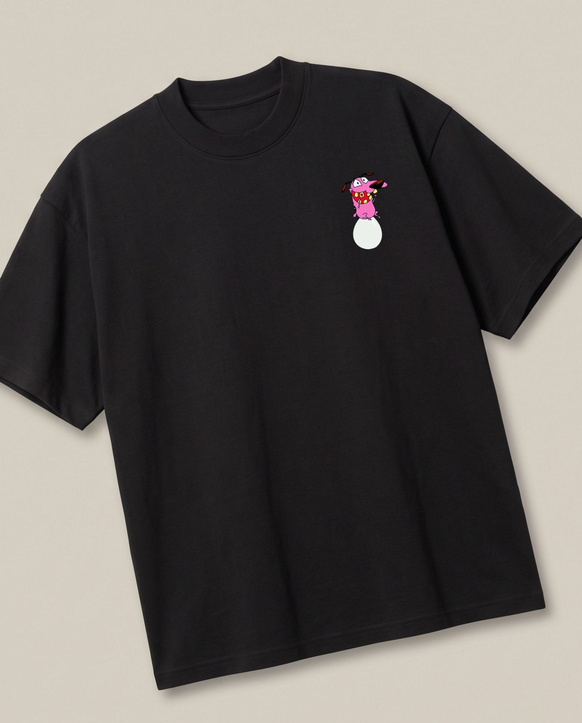Courage's Egg-Sitting Adventure Black oversized t-shirt, angled view