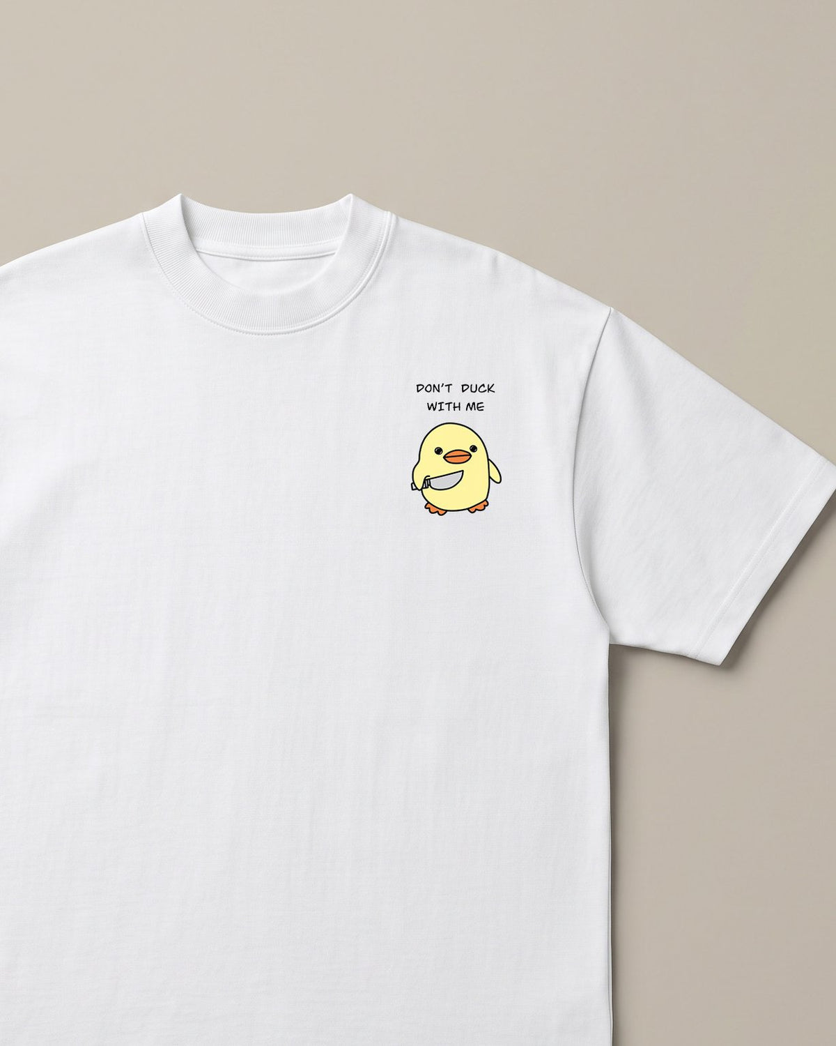 Don't Duck With Me White oversized t-shirt — angry duck holding a knife, front print