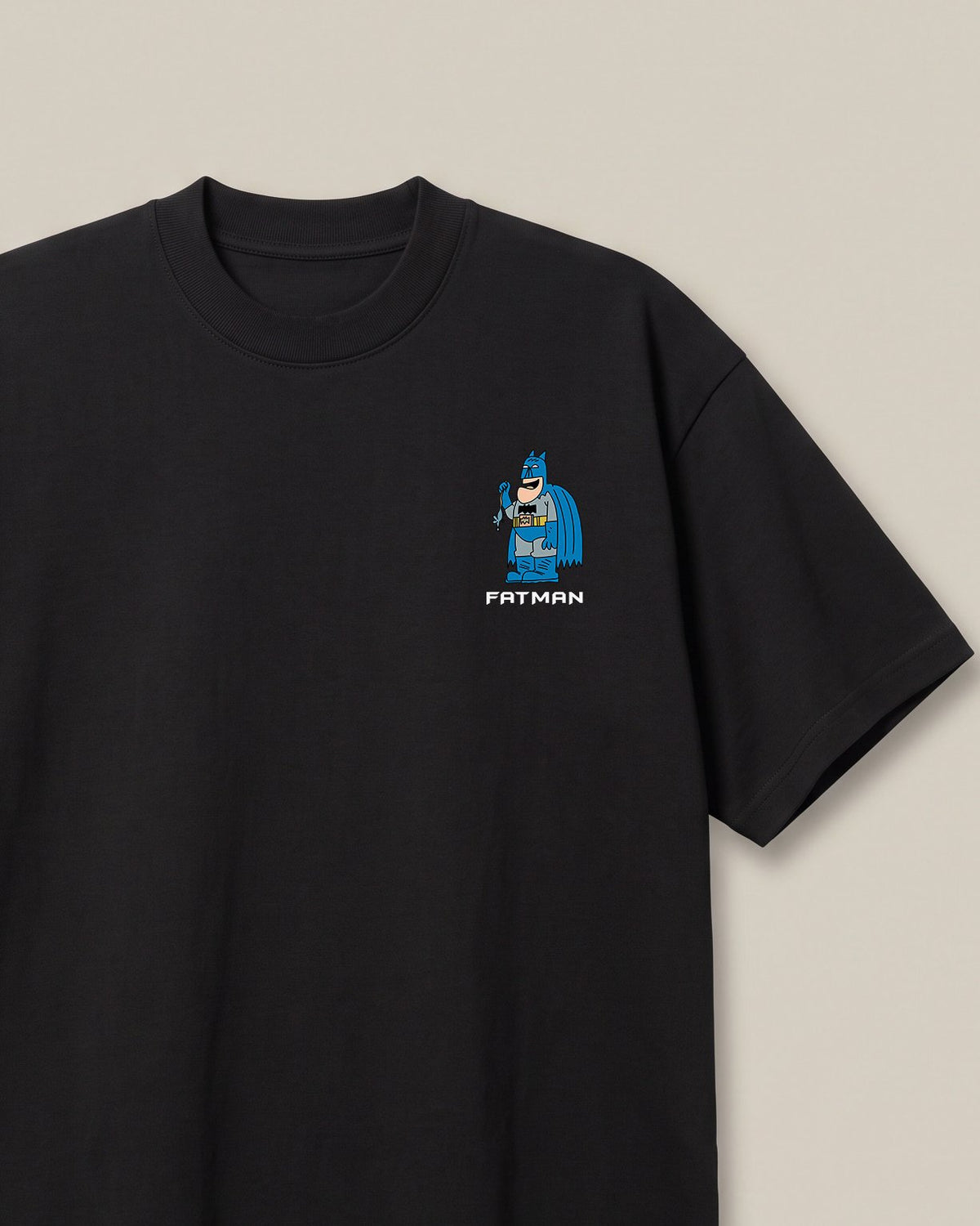 Fatman Black oversized t-shirt — fat batman giving competition to penguin, front print