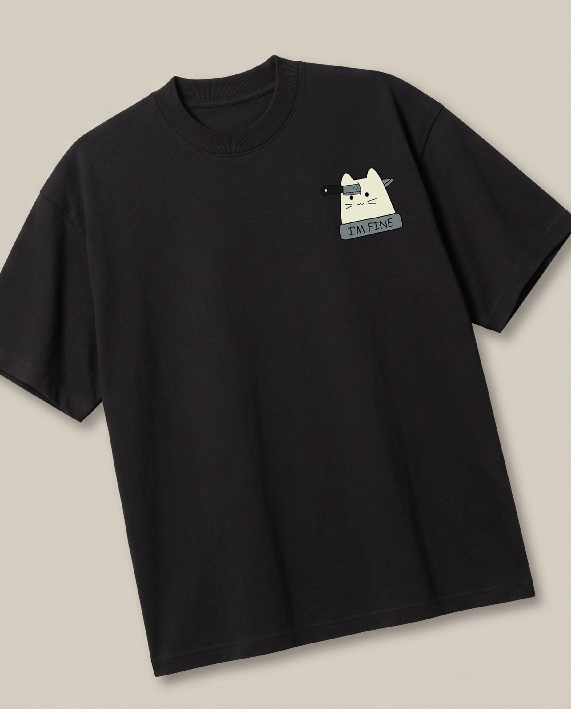 Fine Black oversized t-shirt — cat with a knife sarcastic fine, angled view