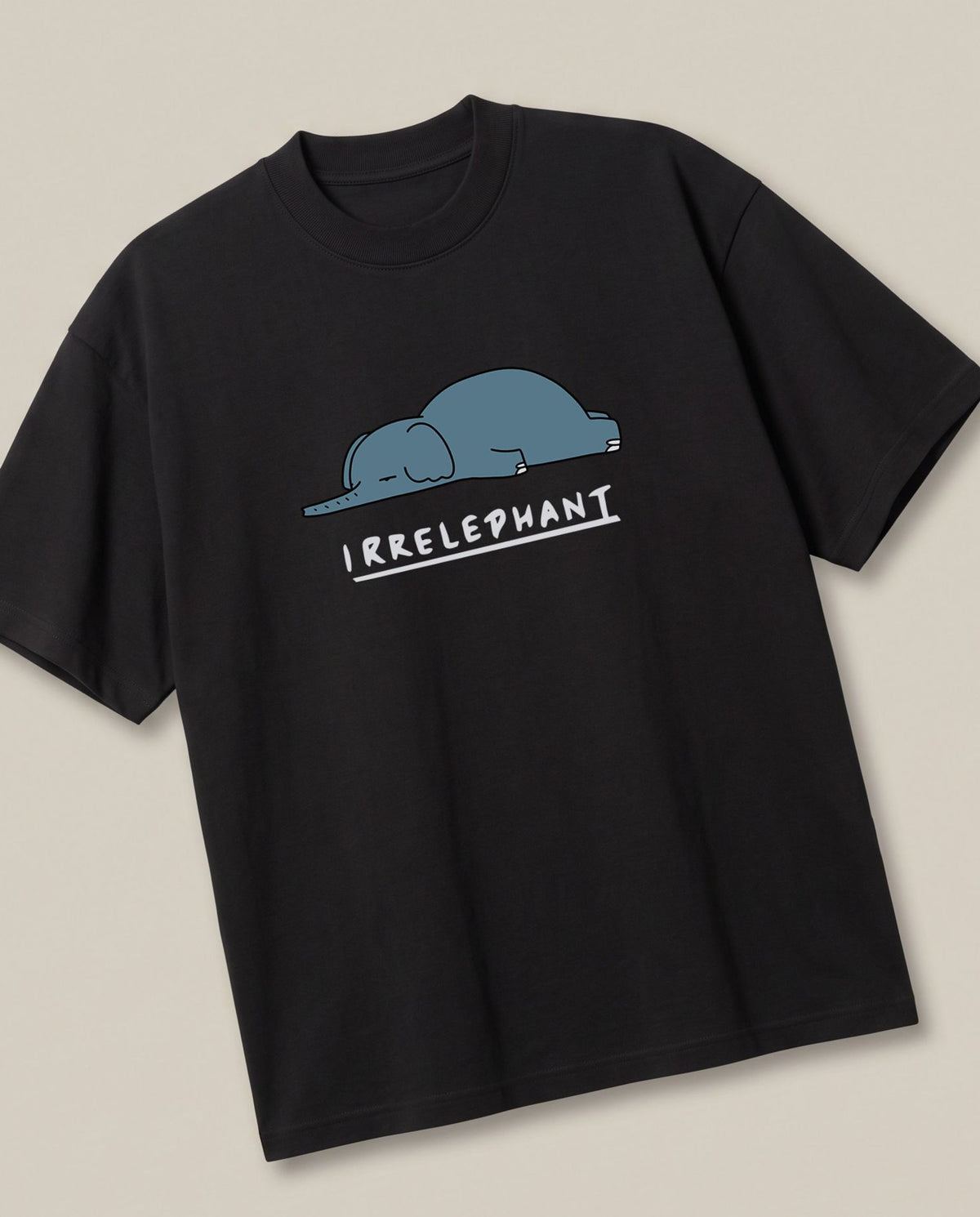 Irrelephant Black oversized t-shirt — the elephant is irrelevent oun, angled view