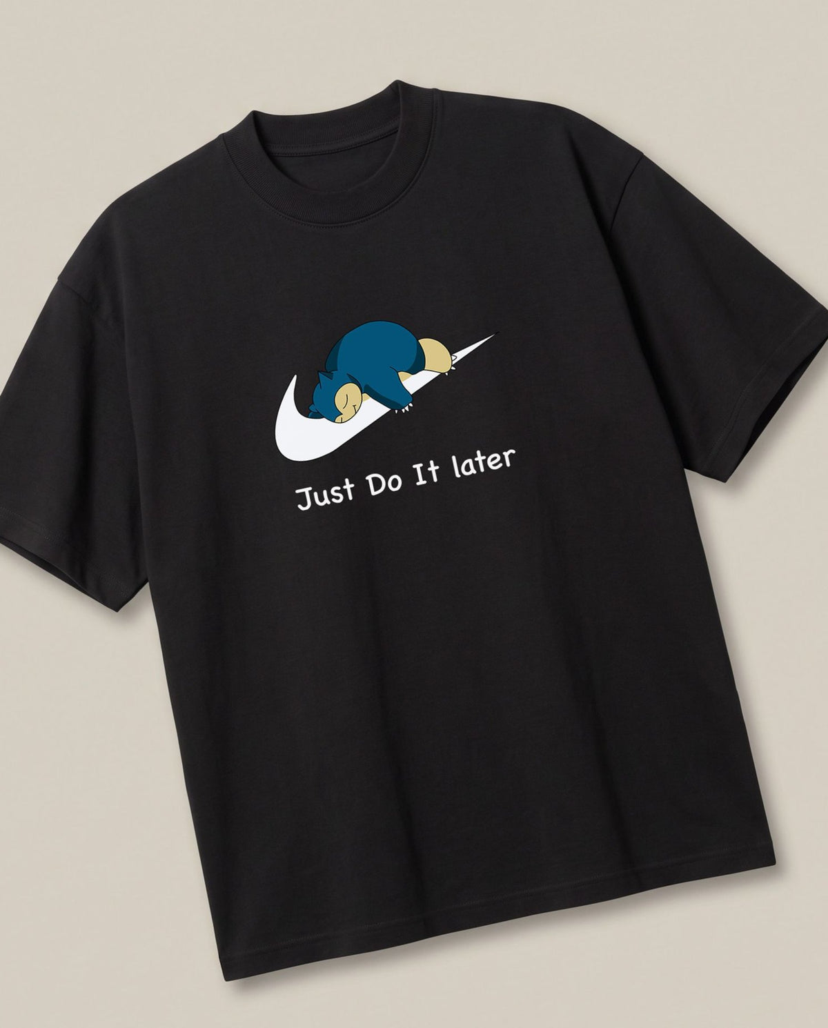 Just Do it Later Black oversized t-shirt — lazy snorlax on a nike swosh, angled view