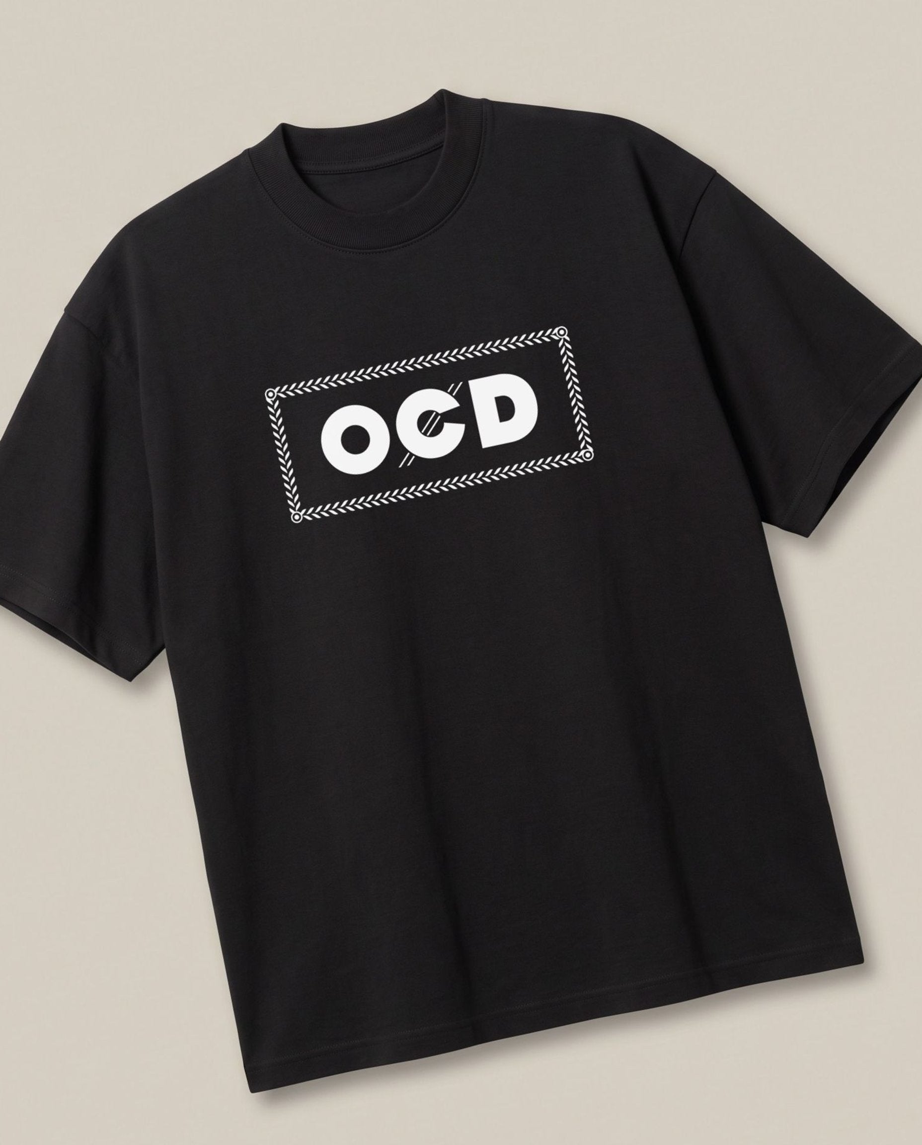 OCD Black oversized t-shirt — rolling paper ocd pun, angled view