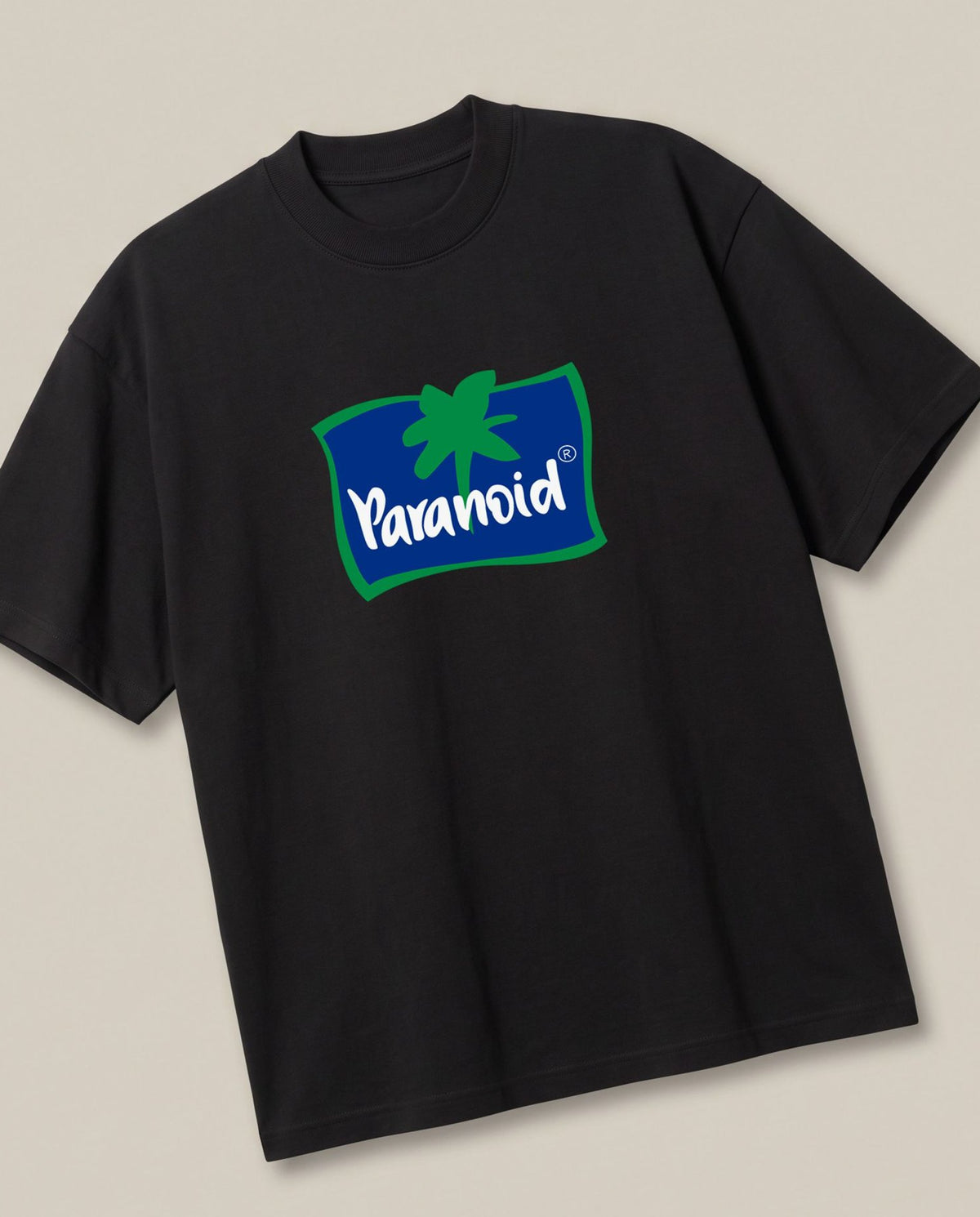 Paranoid Black oversized t-shirt — parchute logo parody, angled view