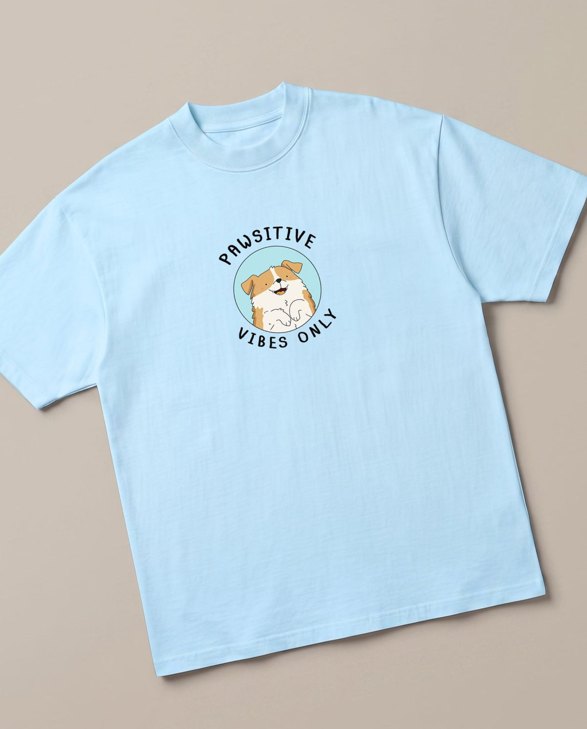 Pawsitive Baby Blue oversized t-shirt — positive vibes only from the doggy, angled view