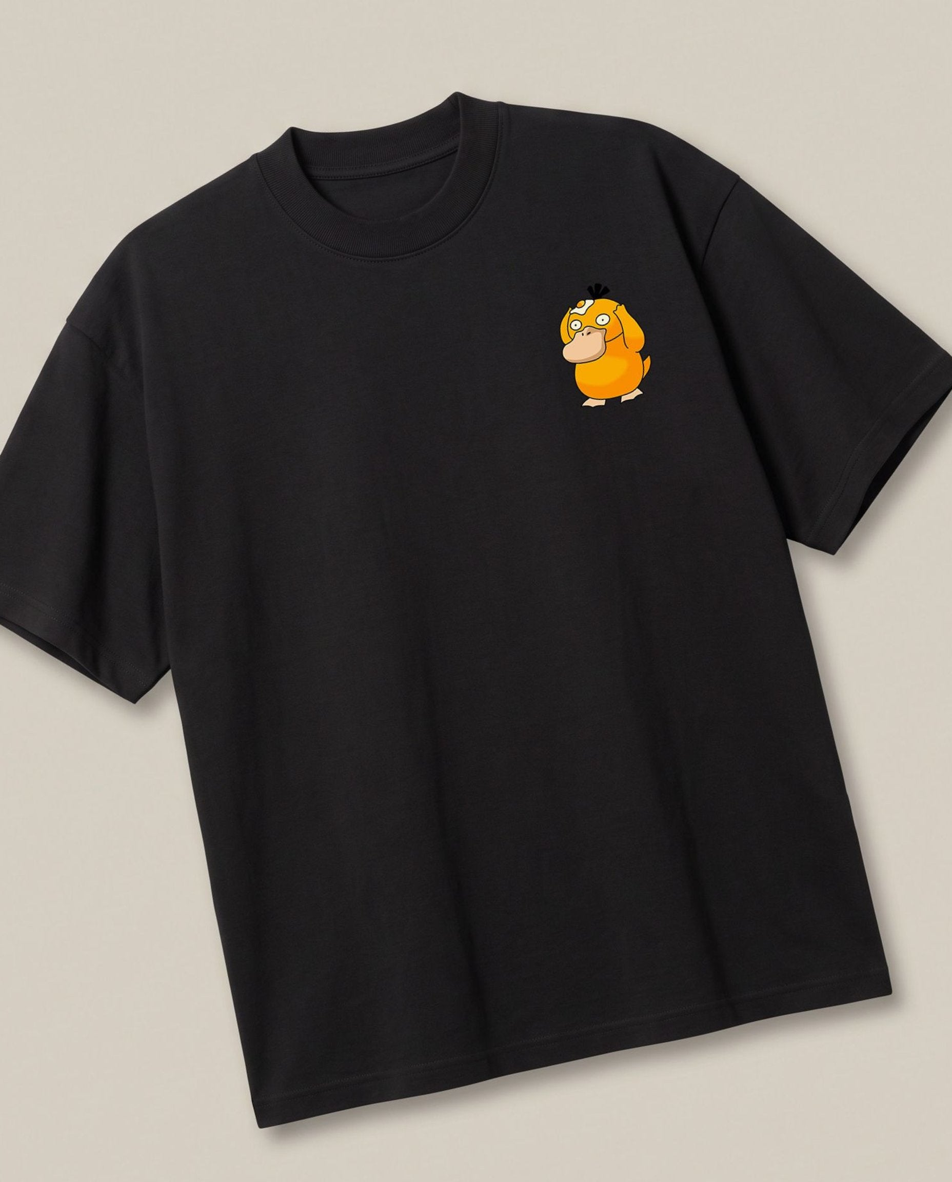 Psyduck Black oversized t-shirt — psyduck pokemon frying egg on his head out of confusion, angled view
