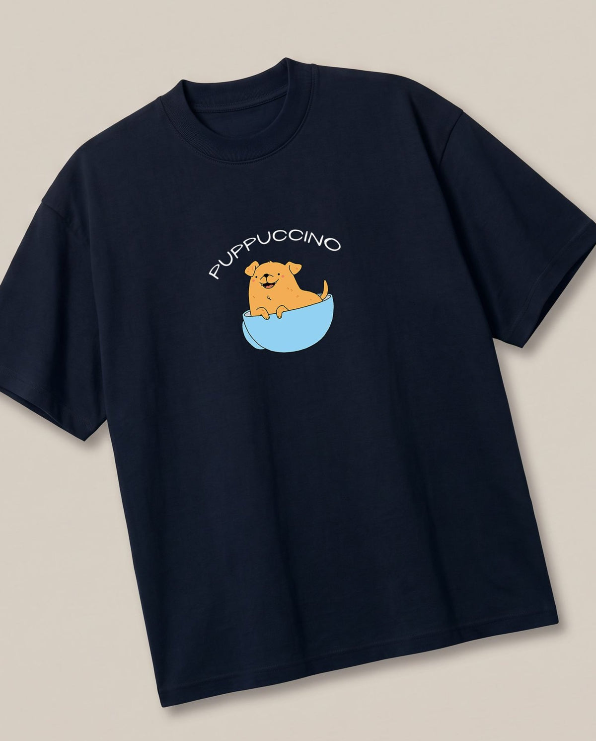 Puppuccino Navy oversized t-shirt — dog in cup of coffee, angled view