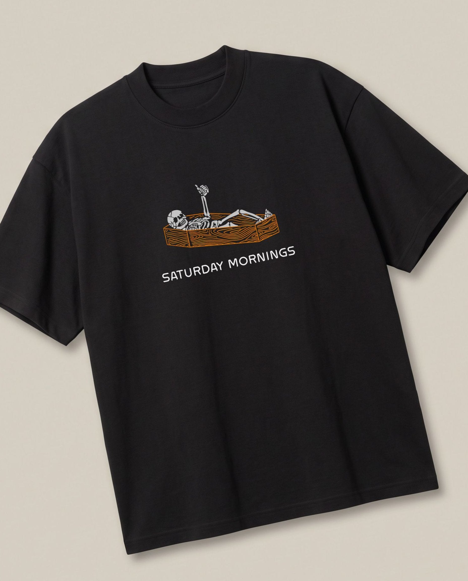 Saturday Mornings! Black oversized t-shirt — like getting hangover from office work, angled view