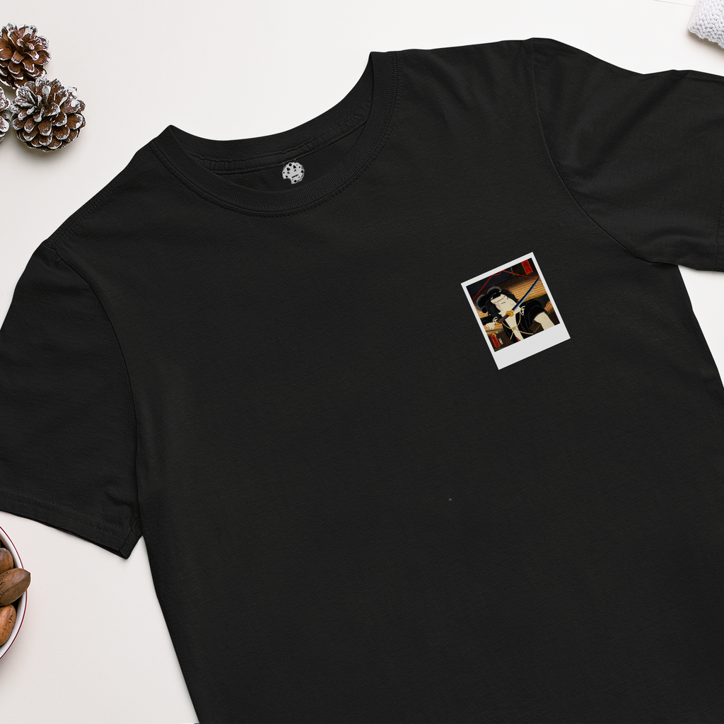 polaroid of Japanese man with sword in mouth on black t-shirt.